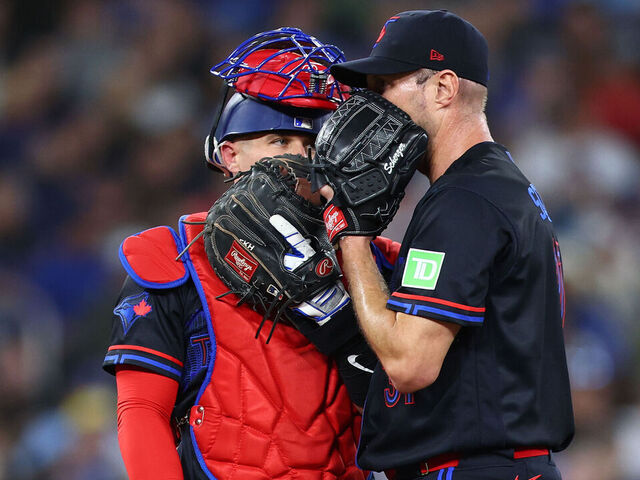 TORONTO, ON - APRIL 24: (L-R) Tyler Heineman #55 of the Toronto Blue Jays speaks to Max Scherzer #31 in the first inning during the game against the Cleveland Guardians at Rogers Centre on April 24, 2025 in Toronto, Ontario, Canada.