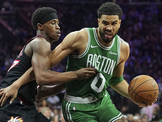 PHILADELPHIA, PENNSYLVANIA - APRIL 24: Jayson Tatum #0 of the Boston Celtics dribbles the ball against Vj Edgecombe #77 of the Philadelphia 76ers in the third quarter during game three of the Eastern Conference first round playoffs at Xfinity Mobile Arena on April 24, 2026 in Philadelphia, Pennsylvania. The Celtics defeated the 76ers 108-100.