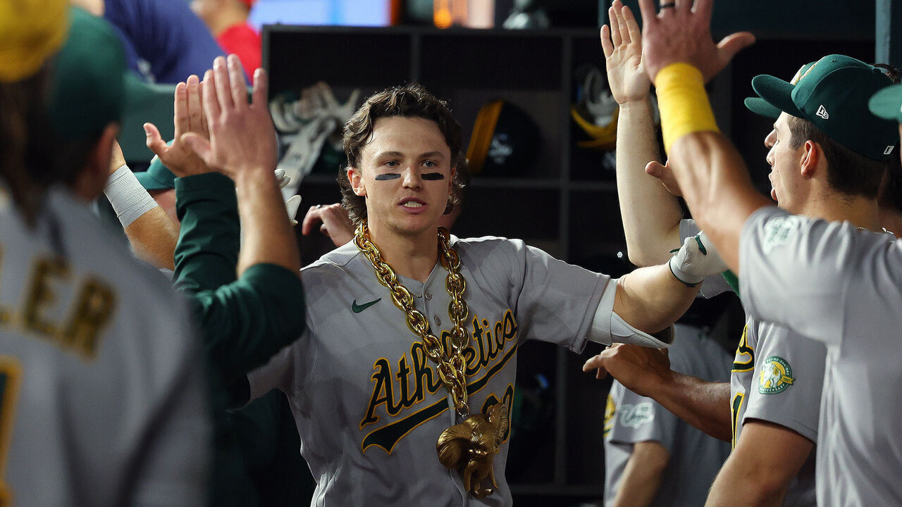 ARLINGTON, TEXAS - APRIL 24: Zack Gelof #20 of the Athletics is greeted in the dugout after hitting a two-run home run in the ninth inning against the Texas Rangers at Globe Life Field on April 24, 2026 in Arlington, Texas.