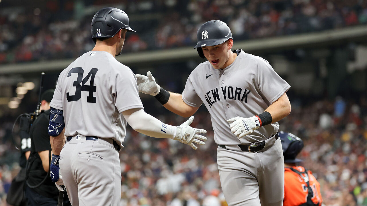 HOUSTON, TEXAS - APRIL 24: Ben Rice #22 of the New York Yankees is congratulated by Randal Grichuk #34 after a home run in the seventh inning against the Houston Astros at Daikin Park on April 24, 2026 in Houston, Texas.