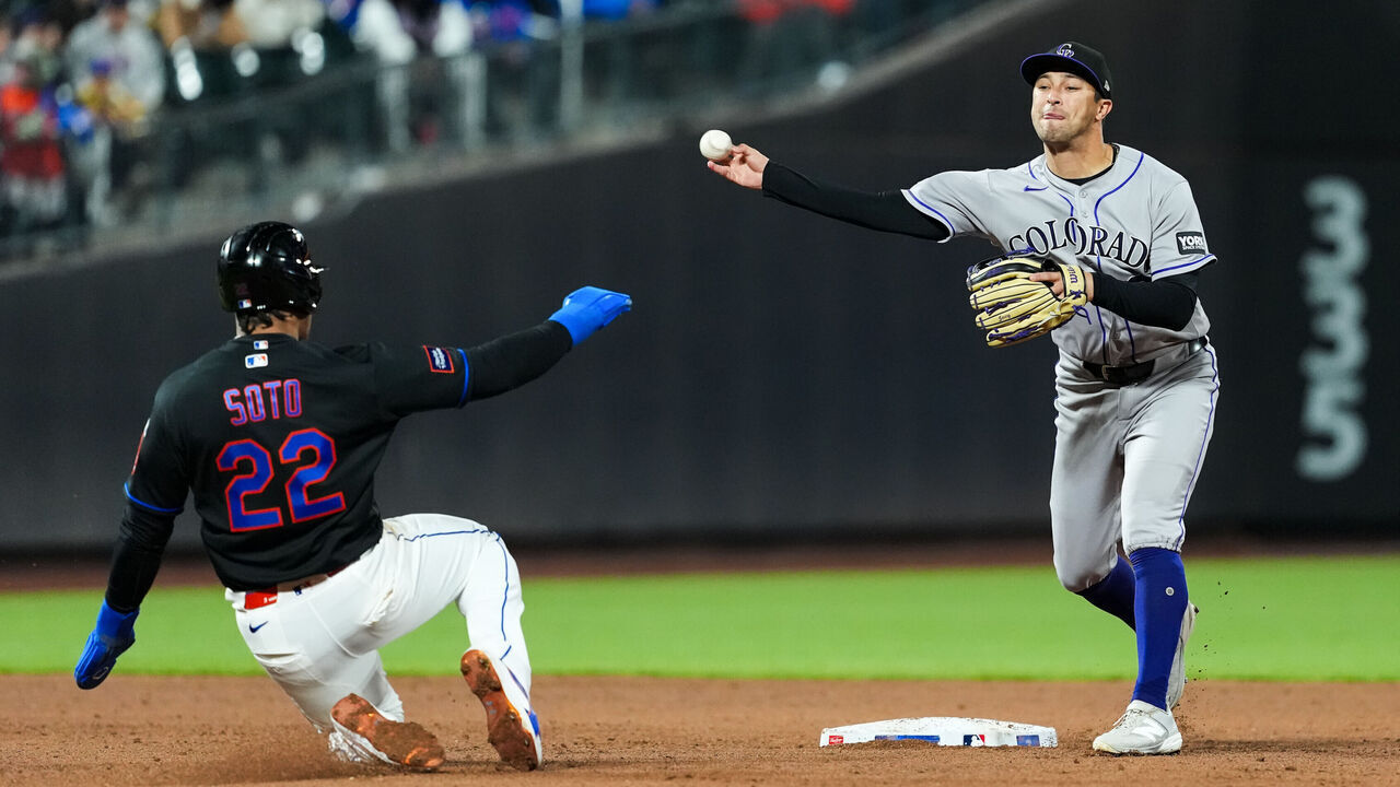 NEW YORK, NY - APRIL 24: Tyler Freeman #2 of the Colorado Rockies throws over Juan Soto #22 of the New York Mets for a double play in the sixth inning during the game between the Colorado Rockies and the New York Mets at Citi Field on Friday, April 24, 2026 in New York, New York.