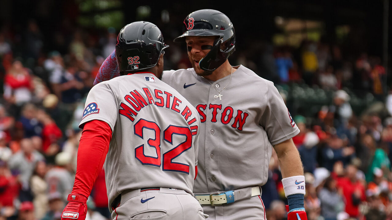 BALTIMORE, MD - APRIL 25: Andruw Monasterio #32 of the Boston Red Sox celebrates with Trevor Story #10 after hitting a grand slam home run against the Baltimore Orioles during the ninth inning at Oriole Park at Camden Yards on April 25, 2026 in Baltimore, Maryland.