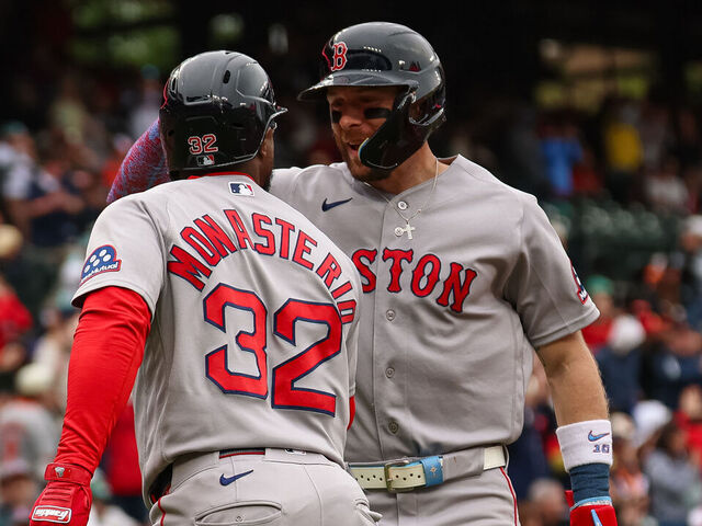 BALTIMORE, MD - APRIL 25: Andruw Monasterio #32 of the Boston Red Sox celebrates with Trevor Story #10 after hitting a grand slam home run against the Baltimore Orioles during the ninth inning at Oriole Park at Camden Yards on April 25, 2026 in Baltimore, Maryland.
