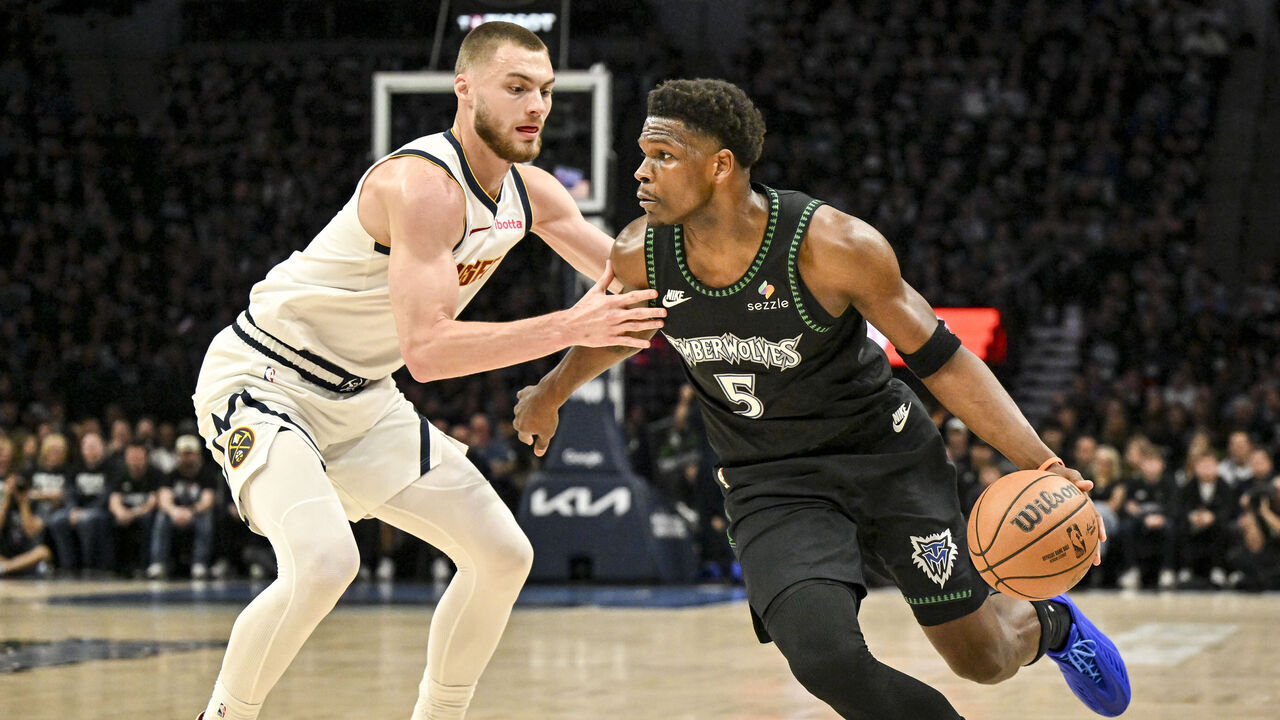 MINNEAPOLIS , MN - APRIL 25: Anthony Edwards (5) of the Minnesota Timberwolves drives on Christian Braun (0) of the Denver Nuggets during the first quarter of game four of their NBA Playoffs series at the Target Center in Minneapolis, Minnesota on Saturday, April 25, 2026.