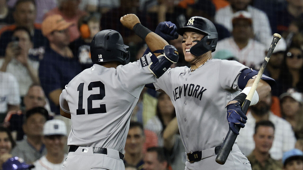 HOUSTON, TEXAS - APRIL 25: Trent Grisham #12 of the New York Yankees celebrates after hitting a solo homerun with Aaron Judge #99 during the second inning against the Houston Astros at Daikin Park on April 25, 2026 in Houston, Texas.