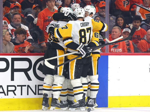 PHILADELPHIA, PENNSYLVANIA - APRIL 25: Kris Letang #58 of the Pittsburgh Penguins celebrates with Sidney Crosby #87 and Rickard Rakell #67 after scoring a goal on Dan Vladar (not pictured) #80 of the Philadelphia Flyers during the third period in Game Four of the First Round of the 2026 Stanley Cup Playoffs at Xfinity Mobile Arena on April 25, 2026 in Philadelphia, Pennsylvania.