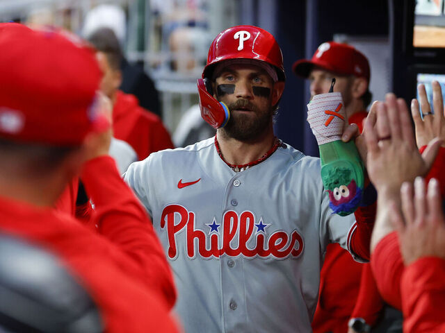 ATLANTA, GEORGIA - APRIL 25: Bryce Harper #3 of the Philadelphia Phillies reacts after scoring during the first inning against the Atlanta Braves at Truist Park on April 25, 2026 in Atlanta, Georgia.