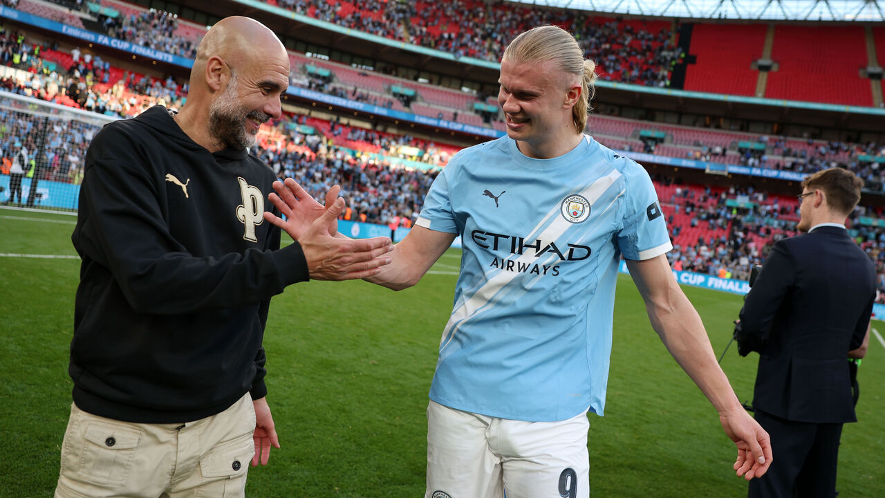 LONDON, ENGLAND - APRIL 25: Pep Guardiola, Manager of Manchester City, shakes hands with Erling Haaland following the team's victory during the Emirates FA Cup Semi Final match between Manchester City and Southampton at Wembley Stadium on April 25, 2026 in London, England.