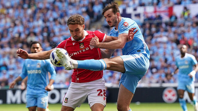 Coventry City's Liam Kitching (right) and Wrexham's Sam Smith during the Sky Bet Championship match at the Coventry Building Society Arena, Coventry. Picture date: Sunday April 26, 2026.