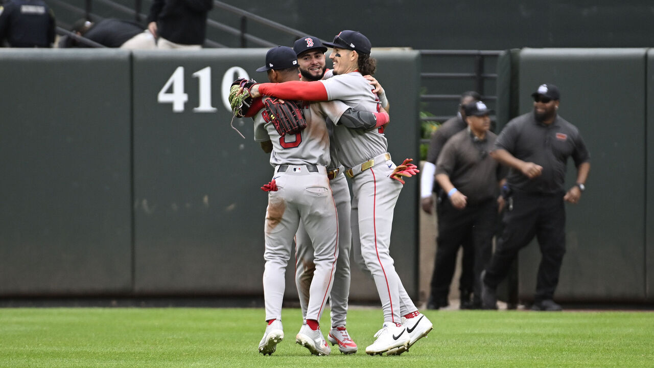 BALTIMORE, MARYLAND - APRIL 25, 2026: Jarren Duran #16, Ceddanne Rafaela #3 and Wilyer Aubreu #52 of the Boston Red Sox celebrate in the outfield following a game against the Baltimore Orioles at Oriole Park on April 24, 2026 in Baltimore, Maryland. The Red Sox beat the Orioles, 17-1.