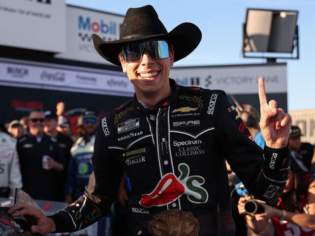 TALLADEGA, ALABAMA - APRIL 26: Carson Hocevar, driver of the #77 Chili's Ride the 'Dente Chevrolet, poses with the winner sticker on his car in victory lane after winning the NASCAR Cup Series Jack Link's 500 at Talladega Superspeedway on April 26, 2026 in Talladega, Alabama.