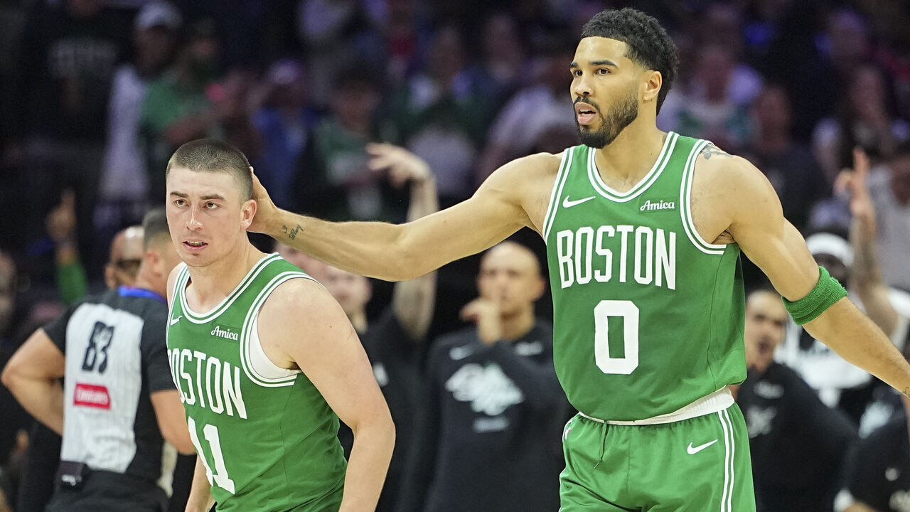 PHILADELPHIA, PENNSYLVANIA - APRIL 24: Jayson Tatum #0 of the Boston Celtics celebrates with Payton Pritchard #11 against the Philadelphia 76ers during game three of the Eastern Conference first round playoffs at Xfinity Mobile Arena on April 24, 2026 in Philadelphia, Pennsylvania. The Celtics defeated the 76ers 108-100.