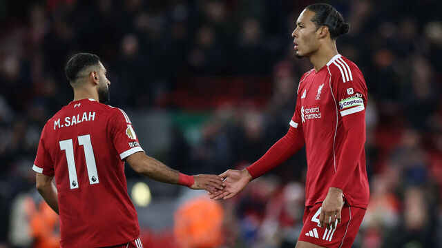 Liverpool's Dutch defender #04 Virgil van Dijk (R) and Liverpool's Egyptian striker #11 Mohamed Salah (L) react at the end of their loss during the English Premier League football match between Liverpool and Nottingham Forest at Anfield in Liverpool, north west England on November 22, 2025. / RESTRICTED TO EDITORIAL USE. No use with unauthorized audio, video, data, fixture lists, club/league logos or 'live' services. Online in-match use limited to 120 images. An additional 40 images may be used in extra time. No video emulation. Social media in-match use limited to 120 images. An additional 40 images may be used in extra time. No use in betting publications, games or single club/league/player publications. /