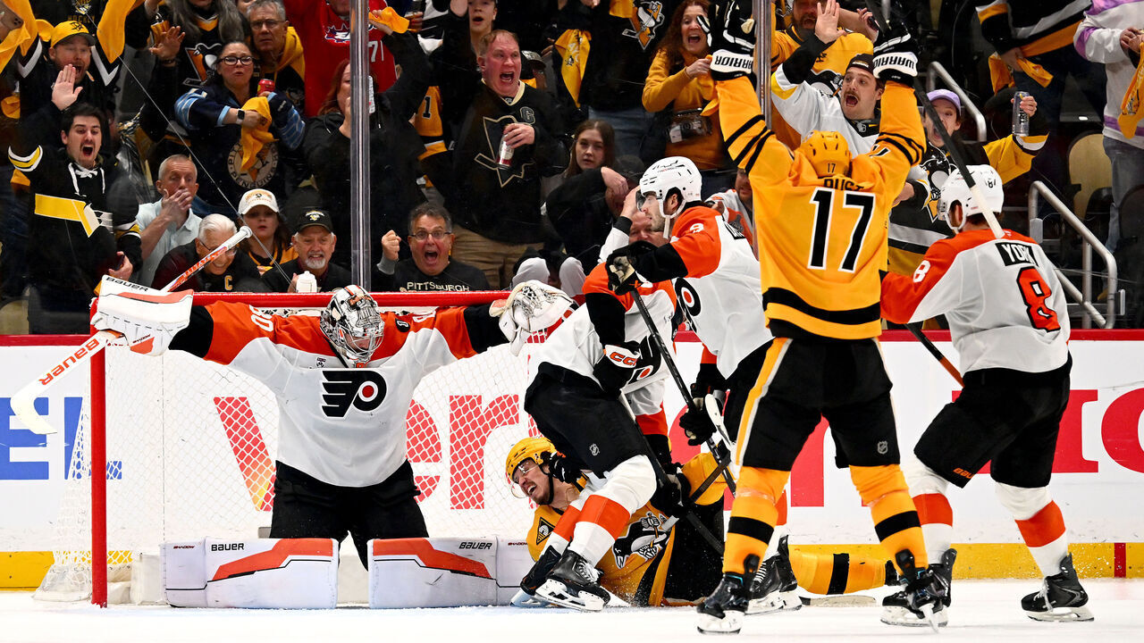 PITTSBURGH, PA - APRIL 27: Bryan Rust #17 of the Pittsburgh Penguins celebrates a goal by Kris Letang #58 (not pictured) against Dan Vladar #80 of the Philadelphia Flyers in Game Five of the First Round of the 2026 Stanley Cup Playoffs at PPG PAINTS Arena on April 27, 2026 in Pittsburgh, Pennsylvania.