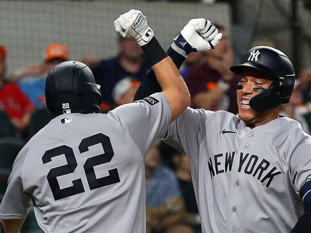 ARLINGTON, TEXAS - APRIL 27: Ben Rice #22 of the New York Yankees celebrates with Aaron Judge #99 of the New York Yankees after Rice's two-run home run in the second inning against the Texas Rangers at Globe Life Field on April 27, 2026 in Arlington, Texas.