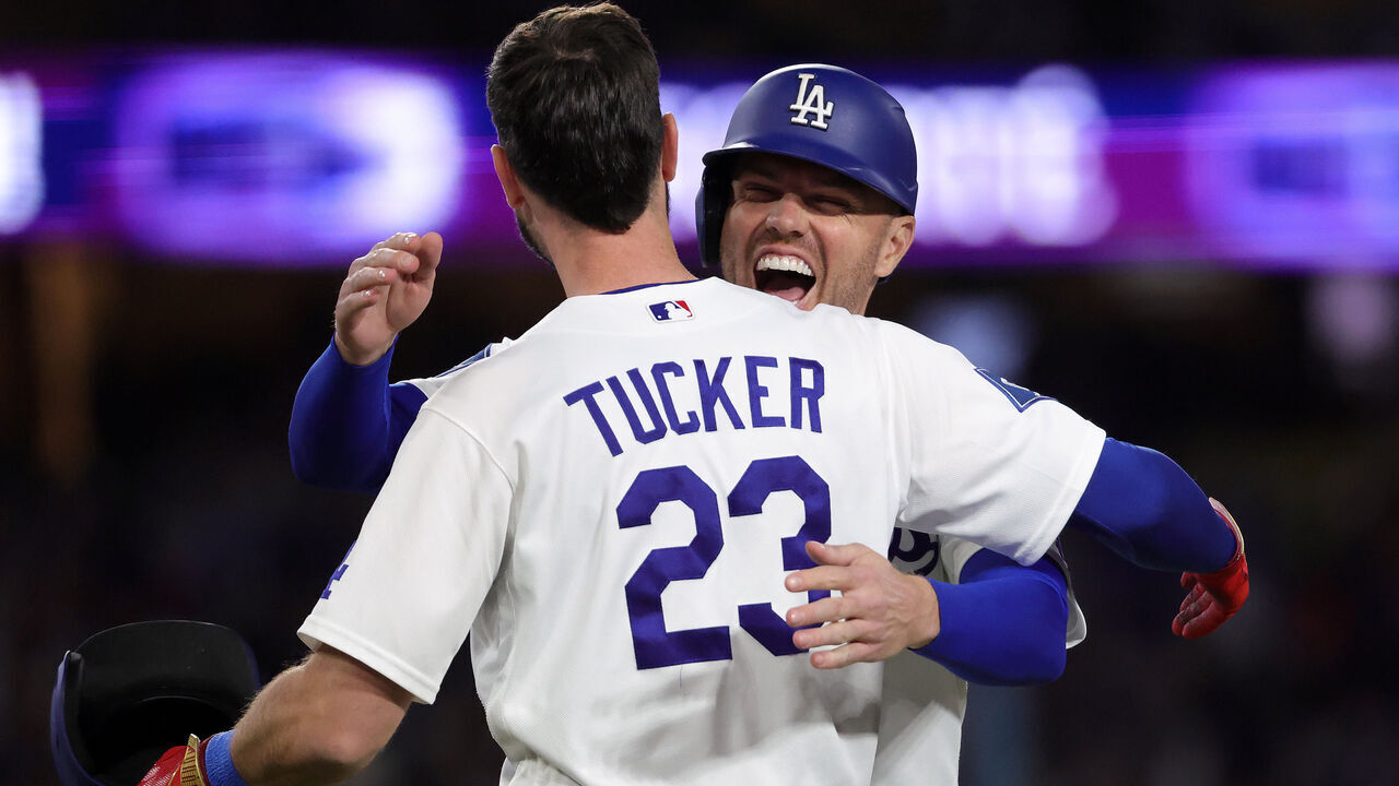 LOS ANGELES, CALIFORNIA - APRIL 27: Kyle Tucker #23 of the Los Angeles Dodgers hugs Freddie Freeman #5 after hitting a two run walk-off single against the Miami Marlins in the ninth inning at Dodger Stadium on April 27, 2026 in Los Angeles, California.