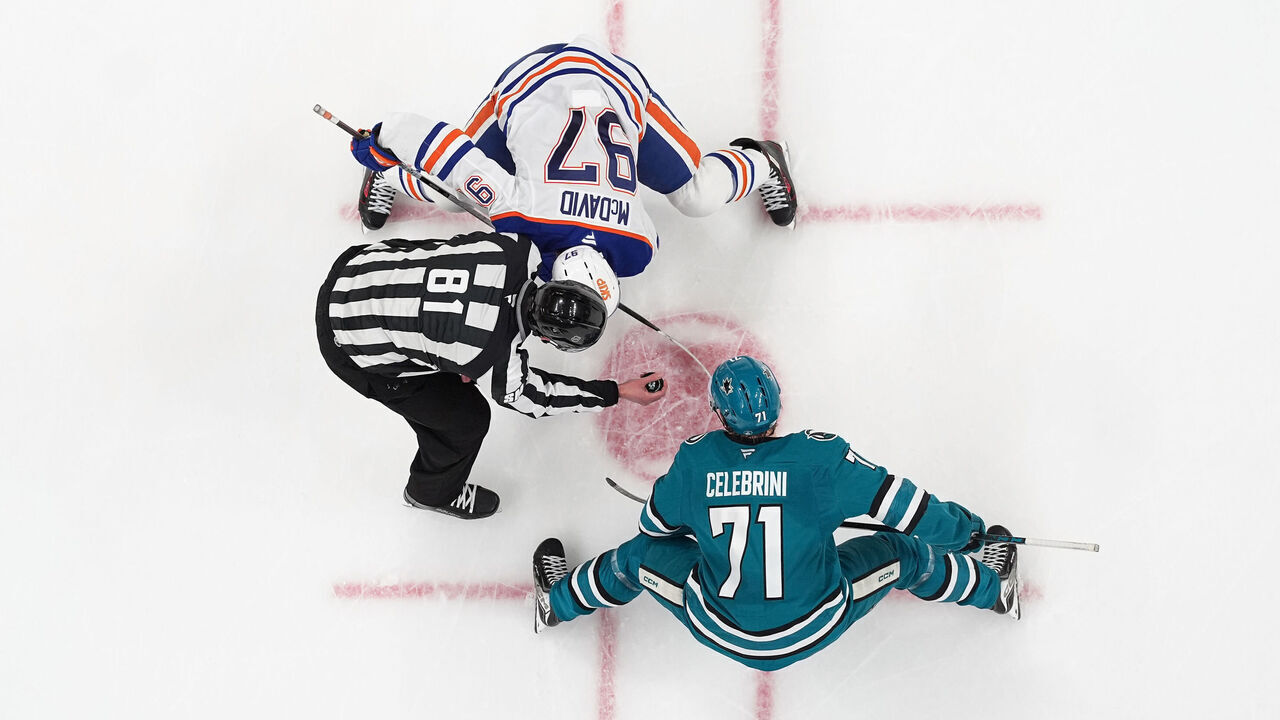 SAN JOSE, CA - APRIL 8: An overhead view as Connor McDavid #97 of the Edmonton Oilers takes a face-off against Macklin Celebrini #71 of the San Jose Sharks in the second period at SAP Center on April 8, 2026 in San Jose, California.