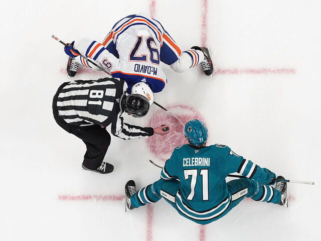 SAN JOSE, CA - APRIL 8: An overhead view as Connor McDavid #97 of the Edmonton Oilers takes a face-off against Macklin Celebrini #71 of the San Jose Sharks in the second period at SAP Center on April 8, 2026 in San Jose, California.