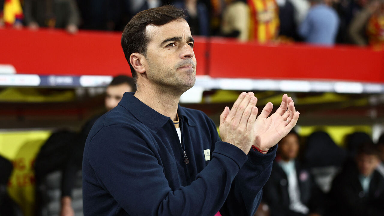 Toulouse's Spanish head coach Carles Martínez Novell applauds at the start of the French Cup semi-final football match between and RC Lens and Toulouse FC at the Stade Bollaert-Delelis in Lens, northern France on April 21, 2026.