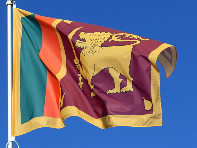 SAINT PETERSBURG, RUSSIA - 2026/04/02: The national flag of the Democratic Socialist Republic of Sri Lanka, fluttering in the wind on a flagpole in Saint Petersburg.