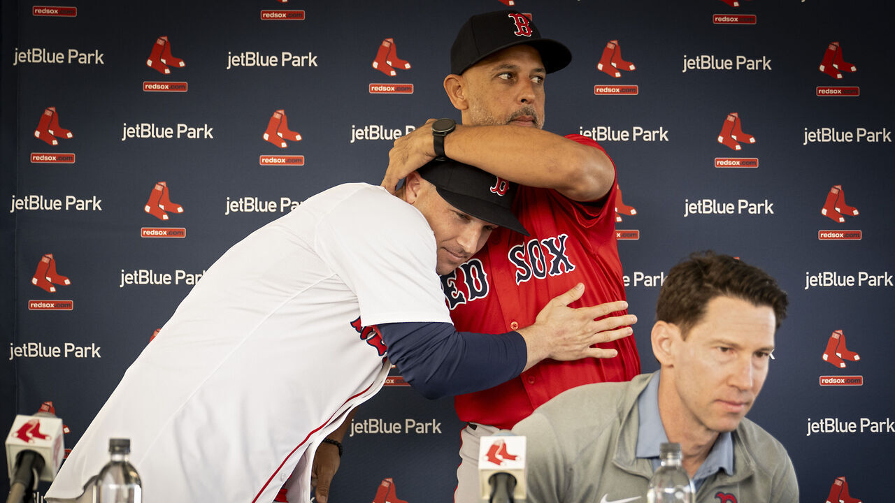 FORT MYERS, FLORIDA - FEBRUARY 16: Alex Bregman #2 of the Boston Red Sox reacts with manager Alex Cora #13 of the Boston Red Sox during his introductory press conference at JetBlue Park at Fenway South in Fort Myers, Florida on February 16, 2025.
