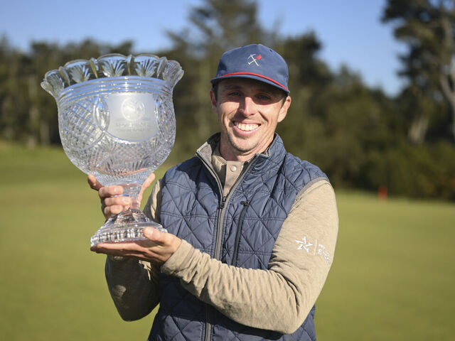 BANDON, OR - APRIL 29: Jesse Droemer poses for a photo with the trophy during the final round of the PGA Professional Championship at Bandon Dunes on Wednesday, April 29, 2026 in Bandon, Oregon.