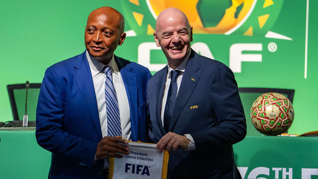 VANCOUVER, CANADA - APRIL 29: Gianni Infantino, FIFA President (R), presents Patrice Motsepe, FIFA Vice-President and President of the Confederation of African Football (CAF) (L), with a gift during CAF Meetings at Vancouver Convention Centre on April 29, 2026 in Vancouver, Canada.