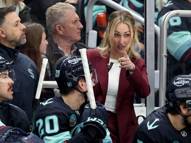 SEATTLE, WASHINGTON - MARCH 10: Assistant Jessica Campbell of the Seattle Kraken talks with Eeli Tolvanen #20 during the second period against the Nashville Predators at Climate Pledge Arena on March 10, 2026 in Seattle, Washington.