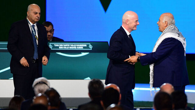 FIFA President Gianni Infantino (C) interacts with the President of the Palestine Football Association Jibril Rajoub as the Vice-President of Israel Football Association Basim Sheikh Suliman (L) looks on during a heated moment in the 76th FIFA Congress in Vancouver, Canada on April 30, 2026.