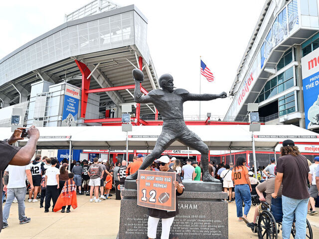 CLEVELAND, OHIO - AUGUST 23: Fans take a photo with a statue of Otto Graham outside Huntington Bank Field before the NFL Preseason 2025 game between Los Angeles Rams and Cleveland Browns on August 23, 2025 in Cleveland, Ohio.