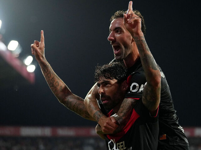 GIRONA, SPAIN - MAY 01: Samu Costa of RCD Mallorca celebrates scoring his team's first goal with teammate Sergi Darder during the LaLiga EA Sports match between Girona FC and RCD Mallorca at Montilivi Stadium on May 01, 2026 in Girona, Spain.