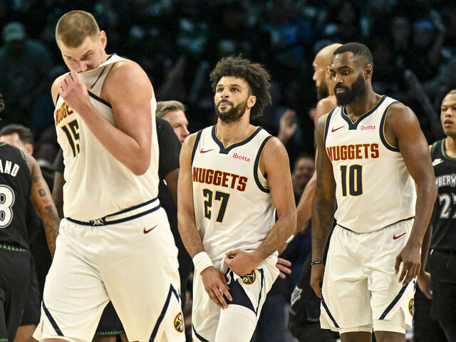 MINNEAPOLIS , MN - APRIL 30: Nikola Jokic (15), Jamal Murray (27) and Tim Hardaway Jr. (10) of the Denver Nuggets walk to the bench for a timeout as the Minnesota Timberwolves celebrate during the third quarter of the Timberwolves' 110-98 Game 6 first round NBA Playoffs series win at the Target Center in Minneapolis, Minnesota on Thursday, April 30, 2026. Minnesota eliminated the Nuggets 4-2.