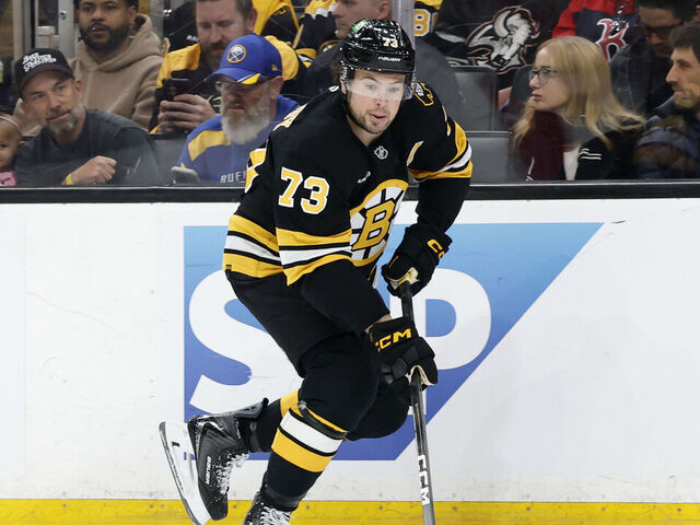 BOSTON, MA - MAY 01: Charlie McAvoy #73 of the Boston Bruins picks up the puck during game 6 of the Stanley Cup Playoffs First Round between the Boston Bruins and the Buffalo Sabres on May 1, 2026, at TD Garden in Boston, Massachusetts.