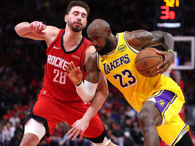 HOUSTON, TEXAS - MAY 01: LeBron James #23 of the Los Angeles Lakers drives to the basket against Alperen Sengun #28 of the Houston Rockets during the fourth quarter in Game Six of the First Round of the NBA Western Conference Playoffs at Toyota Center on May 01, 2026 in Houston, Texas.