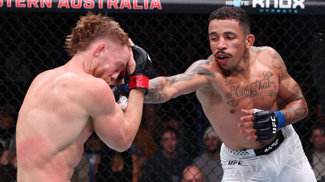 PERTH, AUSTRALIA - MAY 02: (R-L) Carlos Prates of Brazil punches Jack Della Maddalena of Australia in a welterweight fight during the UFC Fight Night event at RAC Arena on May 02, 2026 in Perth, Australia.