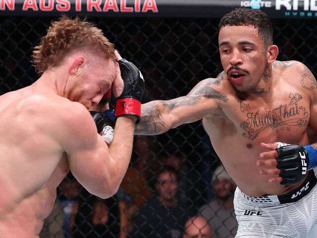 PERTH, AUSTRALIA - MAY 02: (R-L) Carlos Prates of Brazil punches Jack Della Maddalena of Australia in a welterweight fight during the UFC Fight Night event at RAC Arena on May 02, 2026 in Perth, Australia.