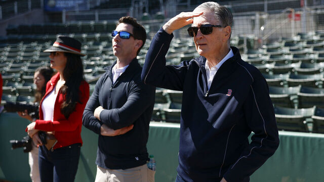 Fort Myers, FL - February 17: Boston Red Sox owner John Henry, Chief Baseball Officer Craig Breslow, and Boston Globe CEO Linda Henry watch live batting practice during spring training at JetBlue Park.