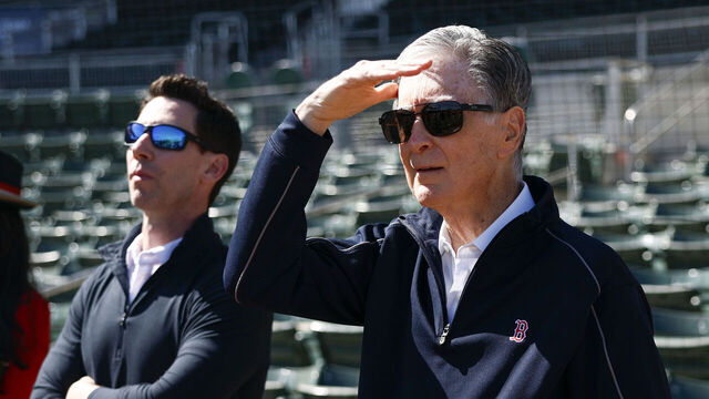 Fort Myers, FL - February 17: Boston Red Sox owner John Henry, Chief Baseball Officer Craig Breslow, and Boston Globe CEO Linda Henry watch live batting practice during spring training at JetBlue Park.