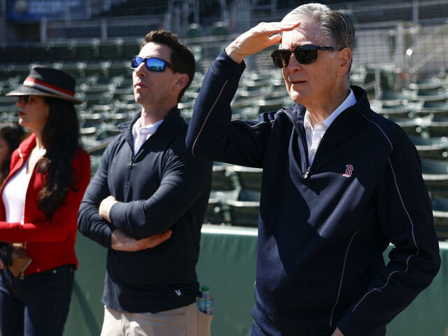 Fort Myers, FL - February 17: Boston Red Sox owner John Henry, Chief Baseball Officer Craig Breslow, and Boston Globe CEO Linda Henry watch live batting practice during spring training at JetBlue Park.