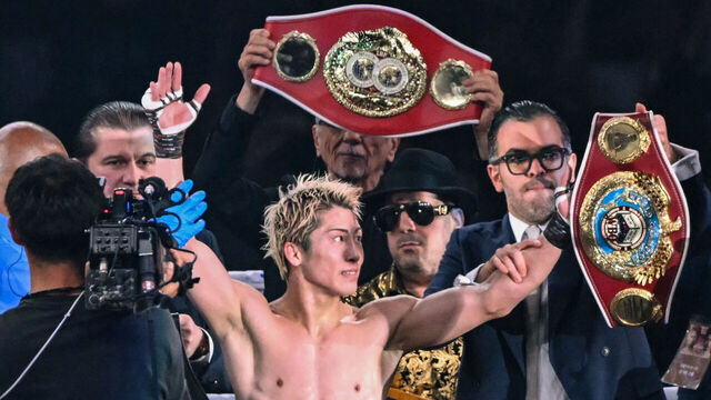 Naoya Inoue (C) celebrates defeating Junto Nakatani in their super bantamweight championship boxing contest at Tokyo Dome in Tokyo on May 2, 2026.