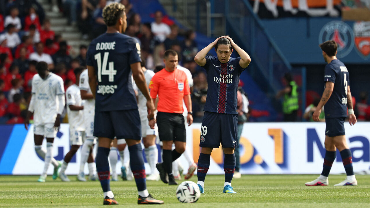 Paris Saint-Germain's South Korean midfielder #19 Kang-In Lee (C) reacts after Lorient's equalizer during the French L1 football match between Paris Saint-Germain (PSG) and FC Lorient at Parc des Princes stadium in Paris on May 2, 2026.