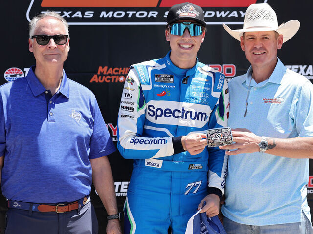 FORT WORTH, TEXAS - MAY 02: Carson Hocevar, driver of the #77 Spectrum Chevrolet, poses for photos after winning the pole award during qualifying for the NASCAR Cup Series Würth 400 presented by LIQUI MOLY at Texas Motor Speedway on May 02, 2026 in Fort Worth, Texas.