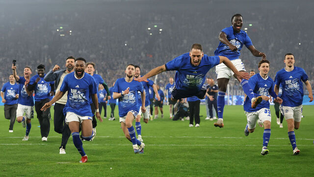 GELSENKIRCHEN, GERMANY - MAY 02: Players of FC Schalke 04 celebrate promotion to the Bundesliga after the team's victory in the 2. Bundesliga match between FC Schalke 04 and Fortuna Düsseldorf at Veltins-Arena on May 02, 2026 in Gelsenkirchen, Germany.