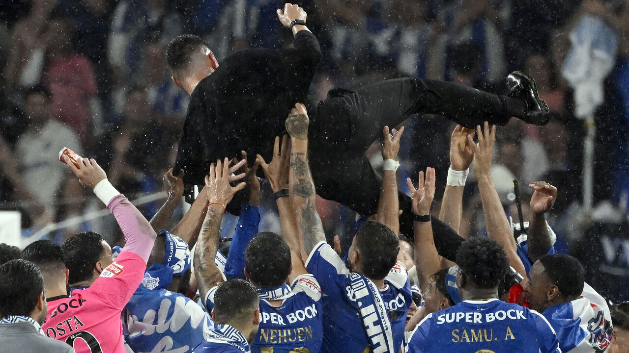 FC Porto's Italian coach Francesco Farioli is tossed in the air by players at the end of the Portuguese League football match between FC Porto and FC Alverca at Dragao stadium in Porto, on May 2, 2026. Porto were crowned Portuguese champions with two games to spare after a 1-0 win over Alverca today.