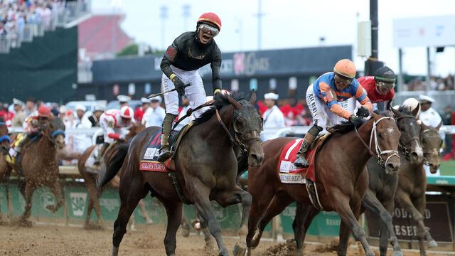 LOUISVILLE, KENTUCKY - MAY 02: Golden Tempo #19, ridden by jockey Jose Ortiz, crosses the finish line to win the 152nd running of the Kentucky Derby at Churchill Downs on May 02, 2026 in Louisville, Kentucky.