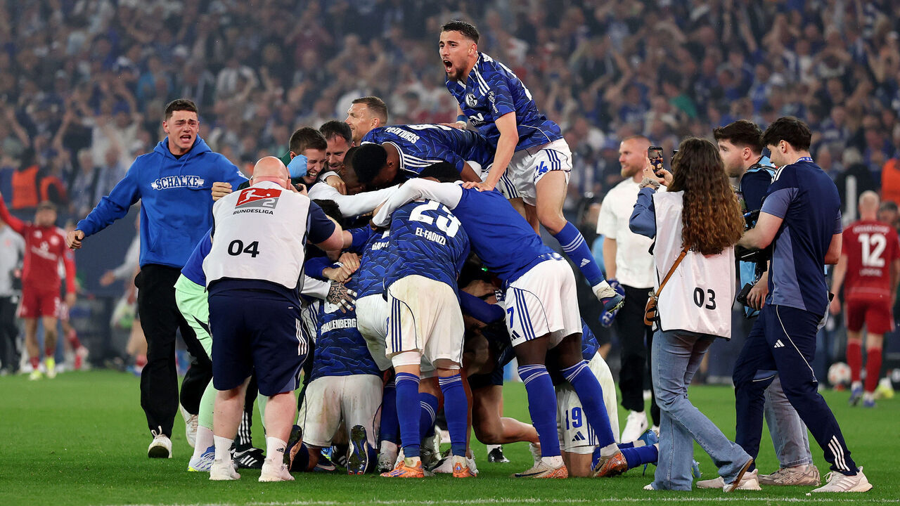 GELSENKIRCHEN, GERMANY - MAY 02: Players of FC Schalke 04 celebrate promotion to the Bundesliga in front of their fans after the team's victory in the 2. Bundesliga match between FC Schalke 04 and Fortuna Düsseldorf at Veltins-Arena on May 02, 2026 in Gelsenkirchen, Germany.