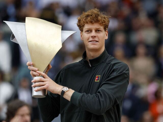 Italy's Jannik Sinner celebrates with his trophy after winning the 2026 ATP Tour Madrid Open tennis tournament final singles match against Germany's Alexander Zverev at the Caja Magica in Madrid, on May 3, 2026.