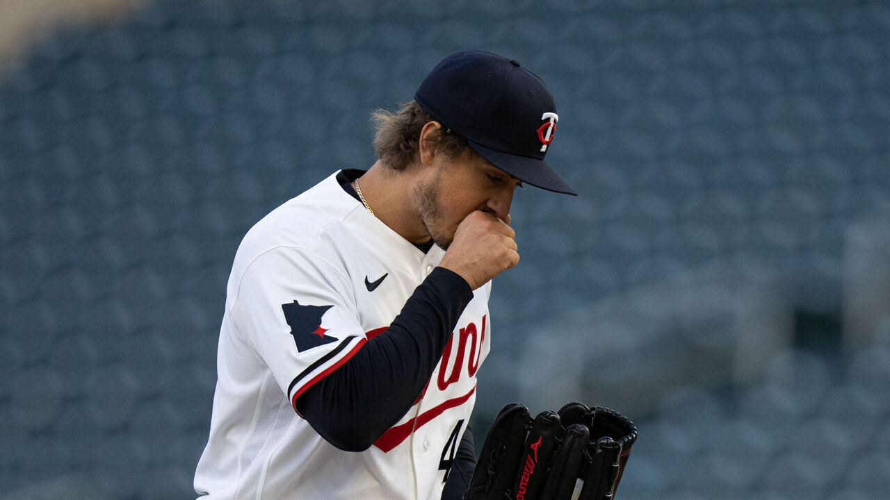 MINNEAPOLIS, MN. - APRIL 2026: Minnesota Twins starting pitcher Joe Ryan warms up his throwing hand on a cool night while pitching to Detroit in the first inning. The temperature was in the mid-30s at the start of the game. The Minnesota Twins faced the Detroit Tigers in an MLB baseball game Monday, April 6, 2026 at Target Field in Minneapolis.