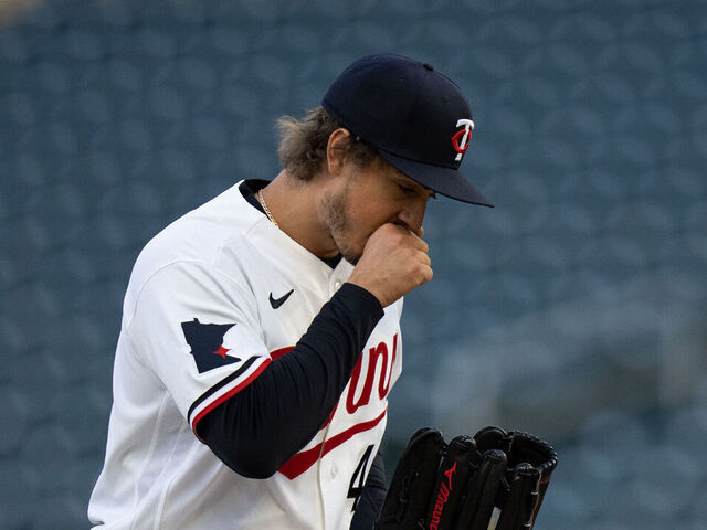 MINNEAPOLIS, MN. - APRIL 2026: Minnesota Twins starting pitcher Joe Ryan warms up his throwing hand on a cool night while pitching to Detroit in the first inning. The temperature was in the mid-30s at the start of the game. The Minnesota Twins faced the Detroit Tigers in an MLB baseball game Monday, April 6, 2026 at Target Field in Minneapolis.