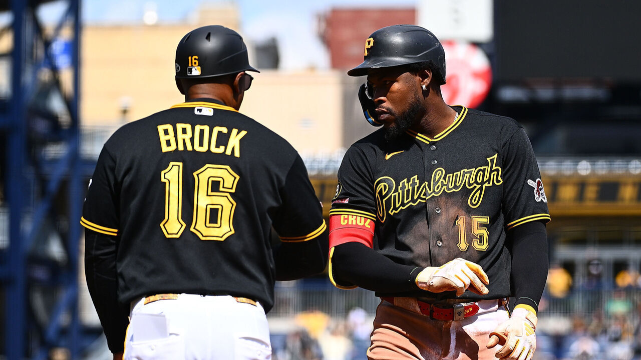 PITTSBURGH, PENNSYLVANIA - MAY 3: Oneil Cruz #15 of the Pittsburgh Pirates celebrates with first base coach Tarrik Brock #16 after hitting an RBI single in the eighth inning during the game against the Cincinnati Reds at PNC Park on May 3, 2026 in Pittsburgh, Pennsylvania.